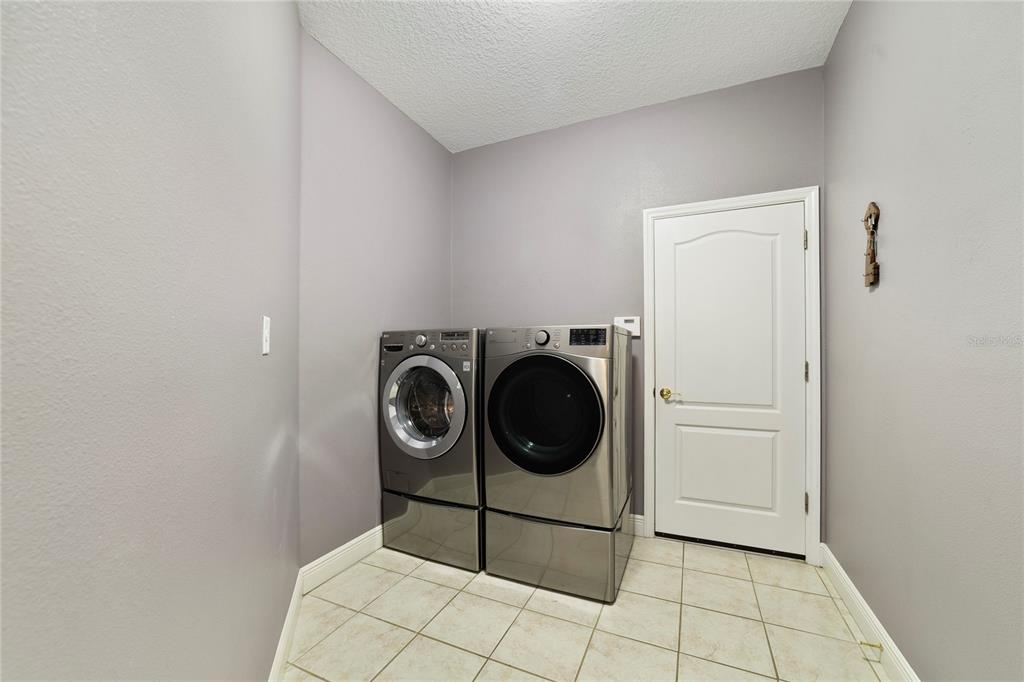 3374 Furlong Way Gotha, FL 34734 - Photo 28 of 38 a utility room with dryer and washer