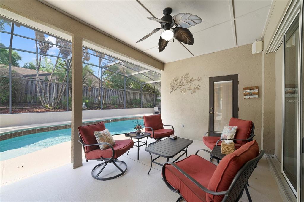 3374 Furlong Way Gotha, FL 34734 - Photo 29 of 38 a living room with furniture a floor to ceiling window and a table
