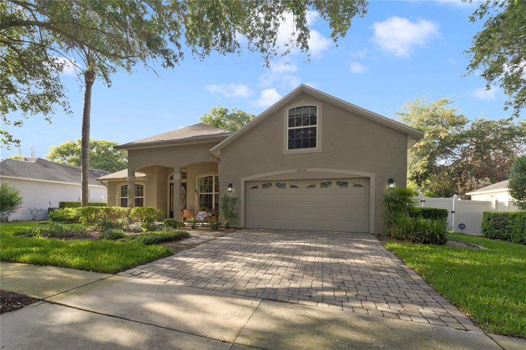 3374 Furlong Way Gotha, FL 34734 - Photo 3 of 38 a view of a house with a yard and potted plants