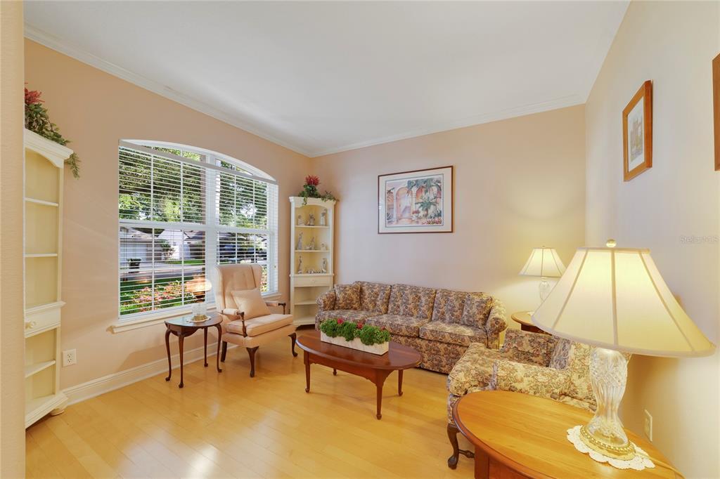 3374 Furlong Way Gotha, FL 34734 - Photo 5 of 38 a living room with furniture and a lamp