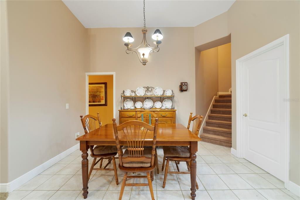 3374 Furlong Way Gotha, FL 34734 - Photo 7 of 38 a dining room with furniture and wooden floor