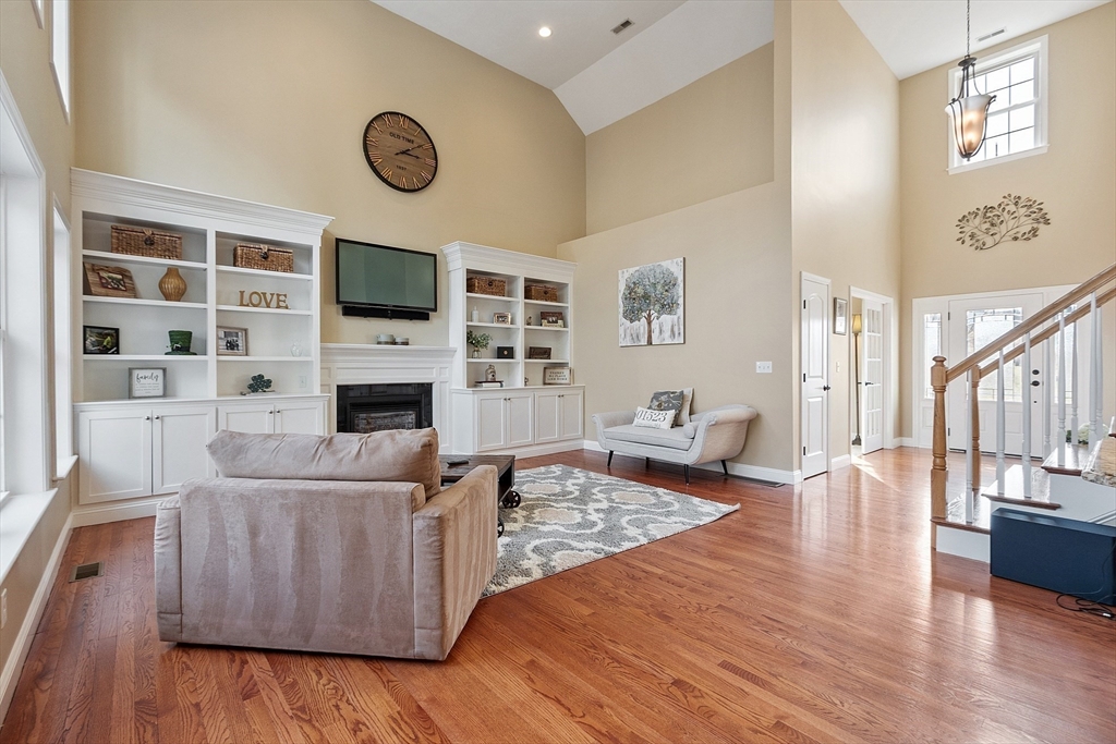 27 Runaway Brook Road Lancaster, MA 01523 - Photo 8 of 30 a living room with furniture and a flat screen tv