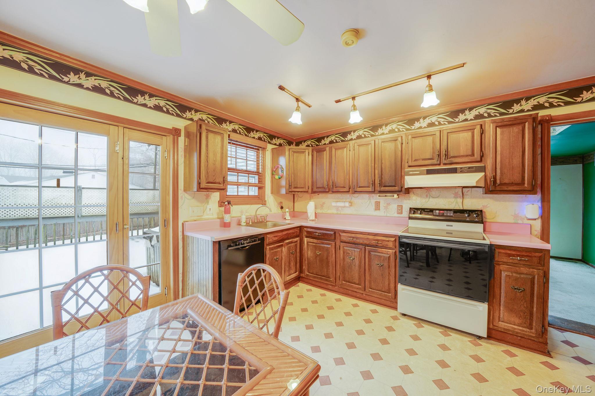 778 Terry Road Hauppauge, NY 11788 - Photo 11 of 29 Eat in Kitchen, sliders to deck, hardwood under linoleum, electric appliances, dishwasher