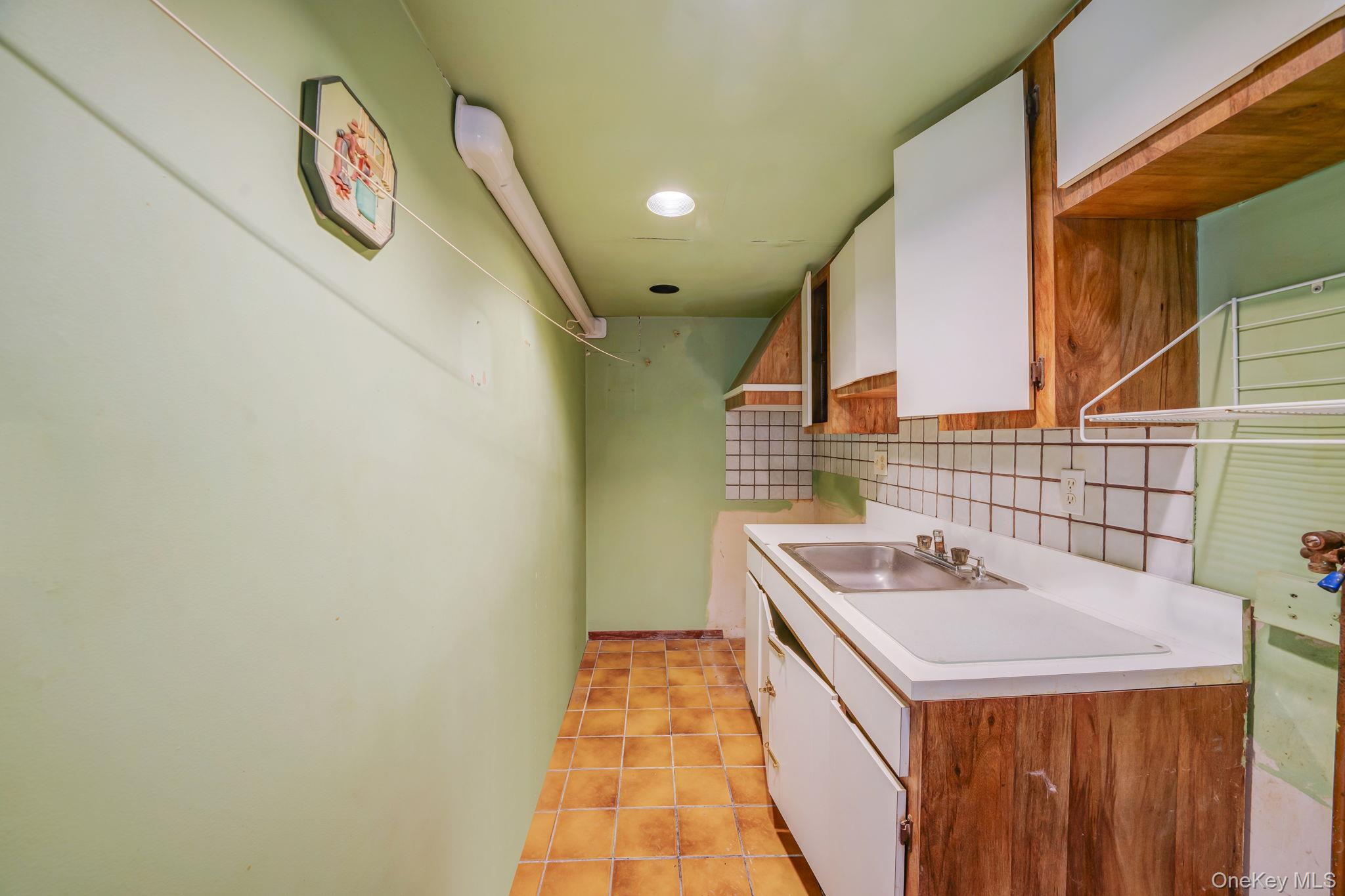 778 Terry Road Hauppauge, NY 11788 - Photo 19 of 29 Main Floor Laundry room with washer/dryer hookups and an auxiliary sink