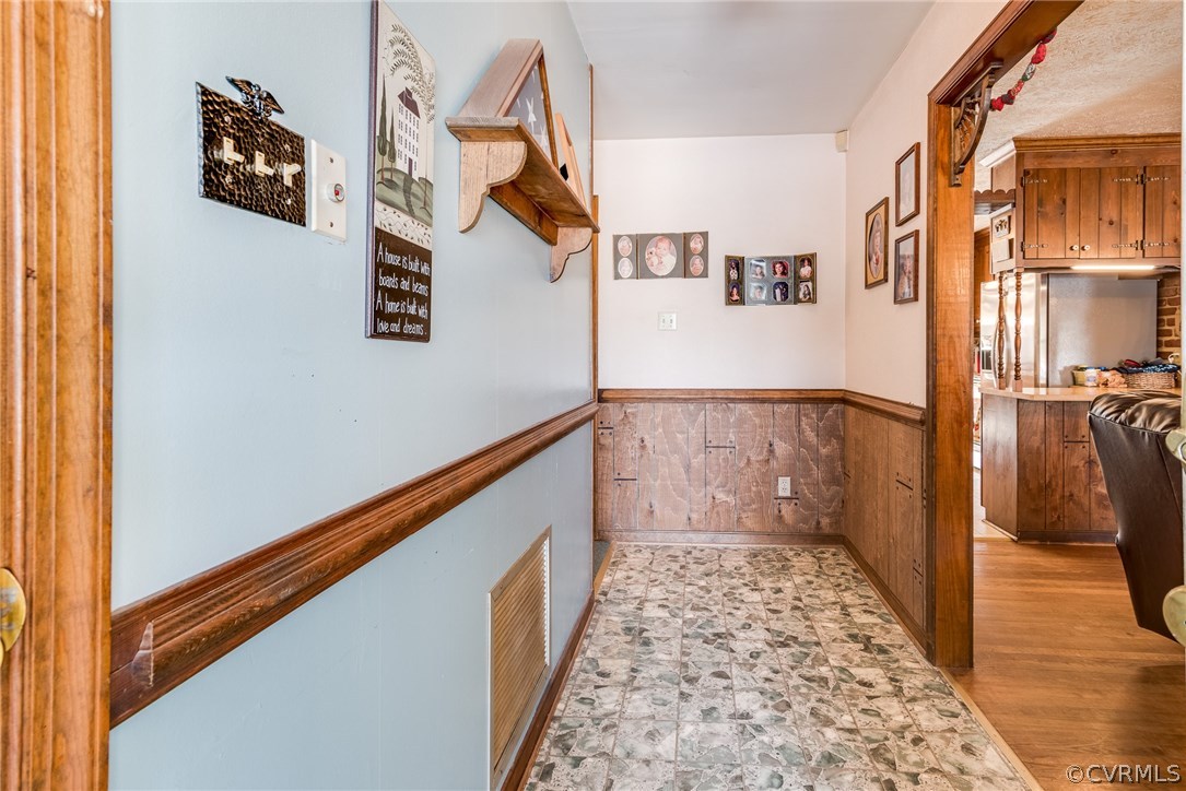 11711 Genito Road Midlothian, VA 23112 - Photo 13 of 18 a view of a hallway with wooden floor and staircase
