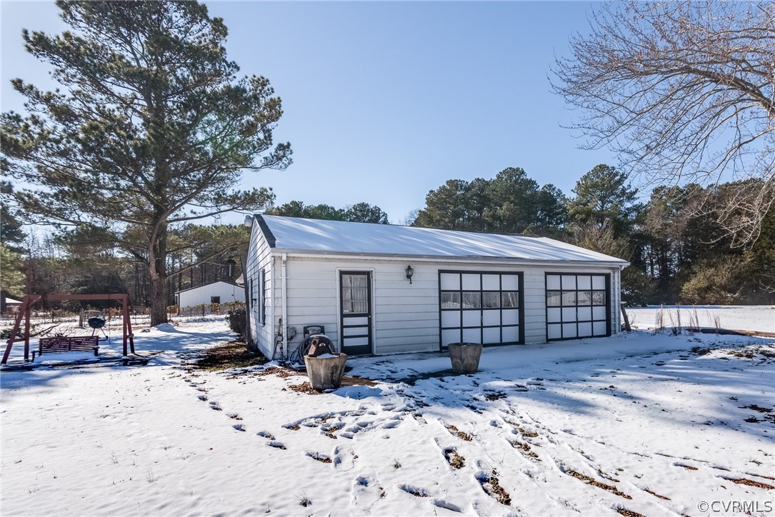 11711 Genito Road Midlothian, VA 23112 - Photo 18 of 18 a view of a house with a yard covered in snow