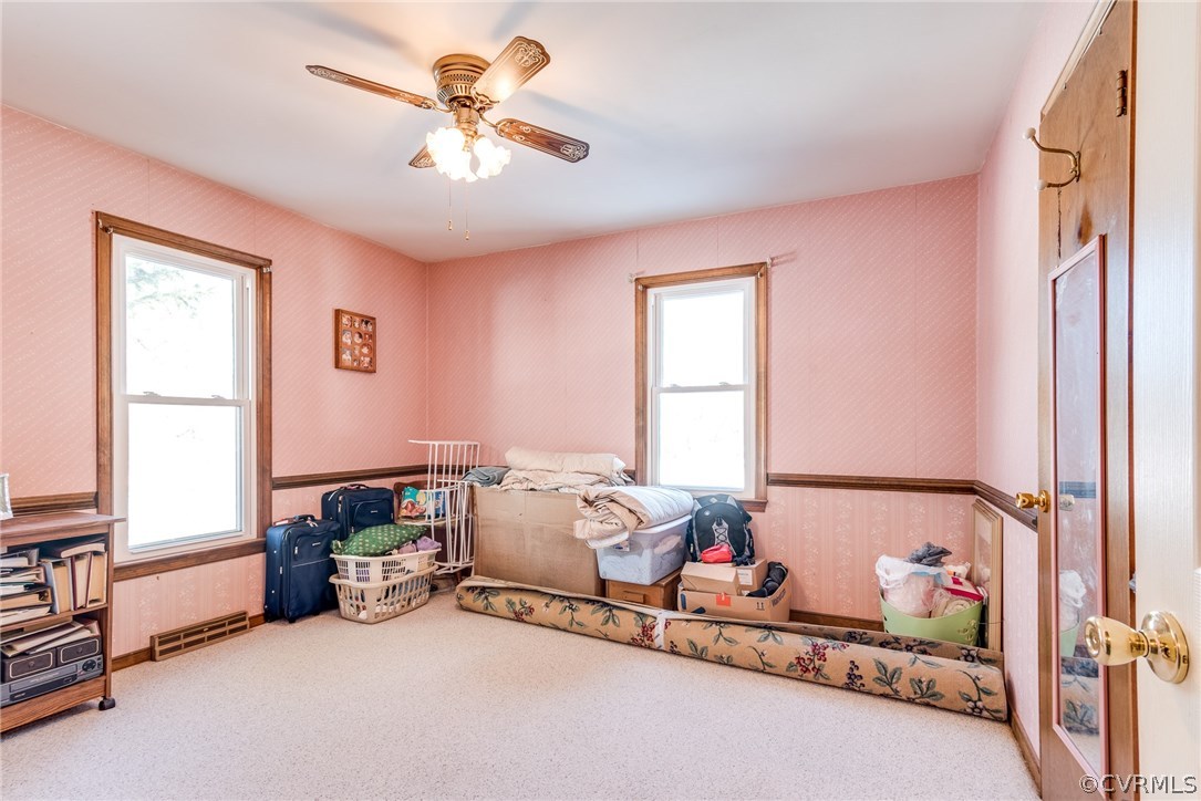 11711 Genito Road Midlothian, VA 23112 - Photo 7 of 18 a bed room with furniture and a window