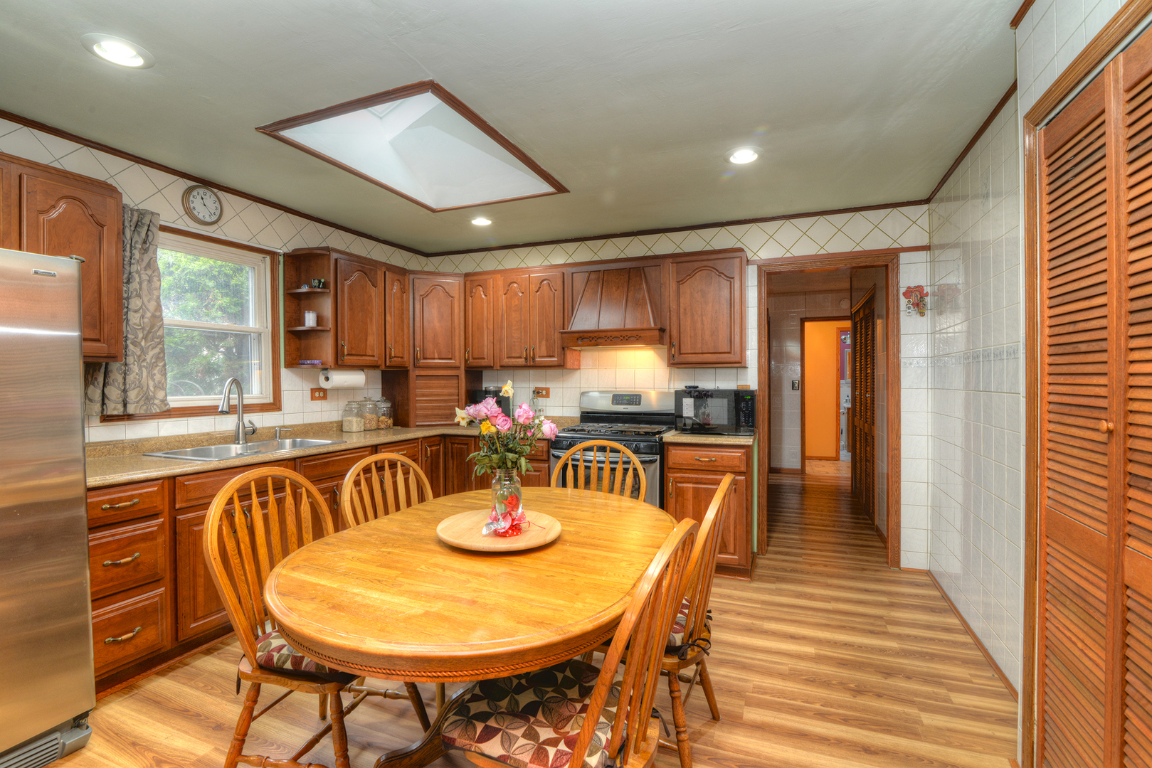 5 Butterfield Road Lake Zurich, IL 60047 - Photo 5 of 32 a view of a dining room with furniture window and wooden floor