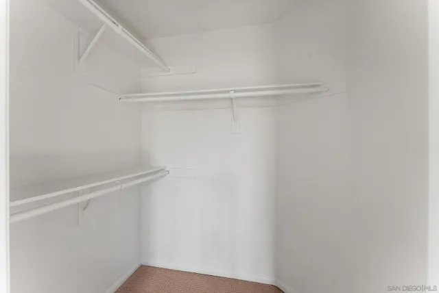 a view of an empty walk in closet