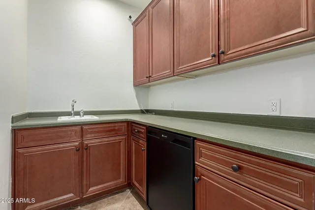 a bathroom with a double vanity sink mirror and toilet
