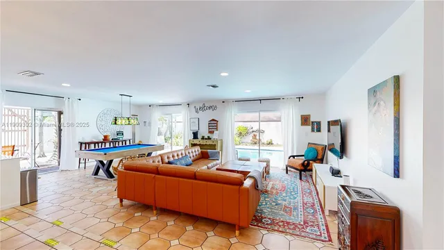 a kitchen with stainless steel appliances granite countertop a sink and wooden cabinets