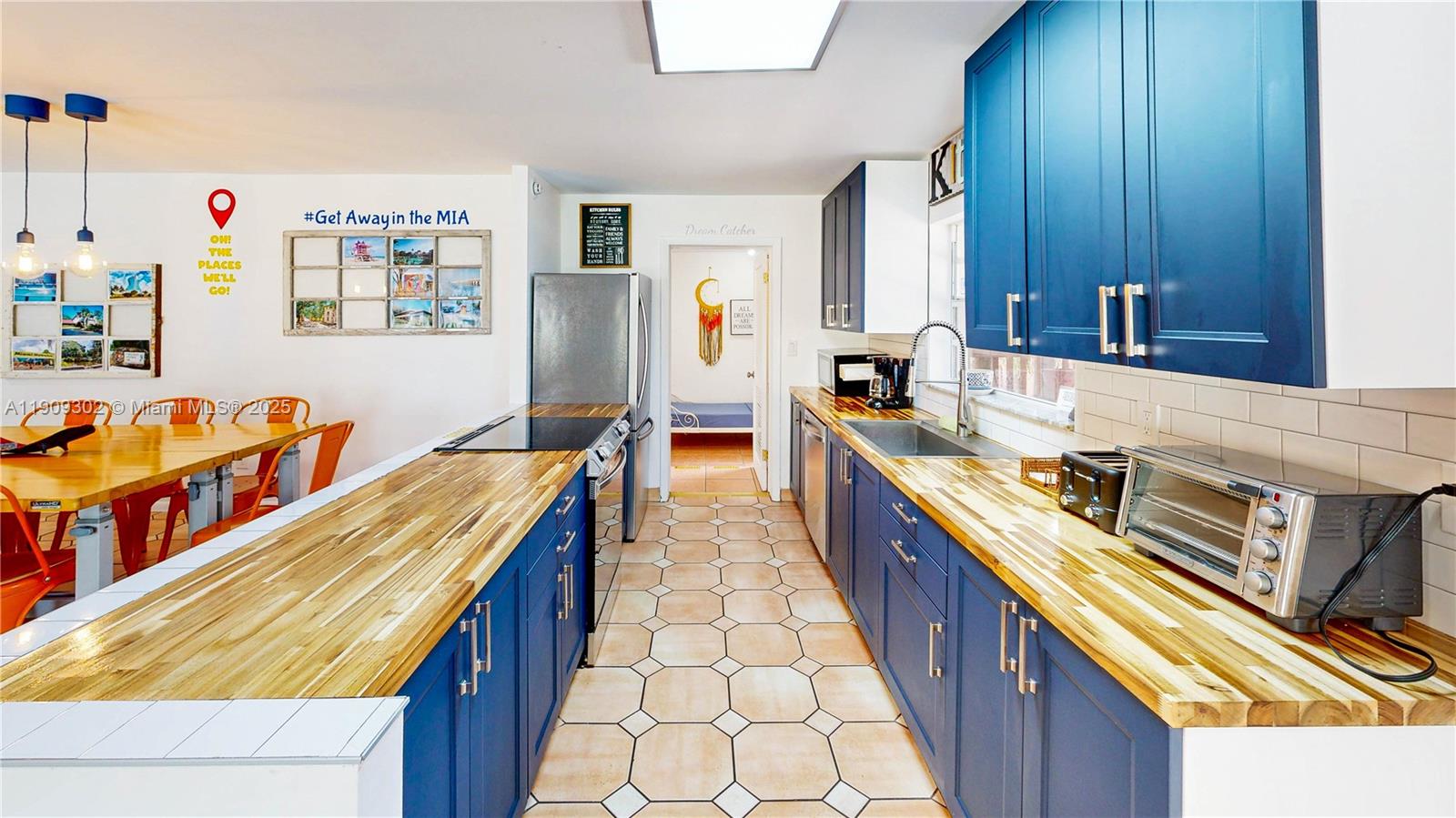 9614 Southwest 134th Court Miami, FL 33186 - Photo 19 of 69 a kitchen with stainless steel appliances granite countertop a sink and wooden cabinets