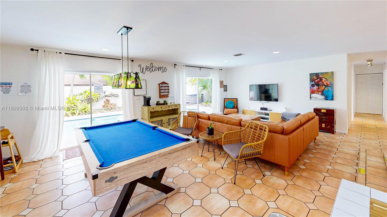 9614 Southwest 134th Court Miami, FL 33186 - Photo 22 of 69 a living room with furniture a flat screen tv and a window