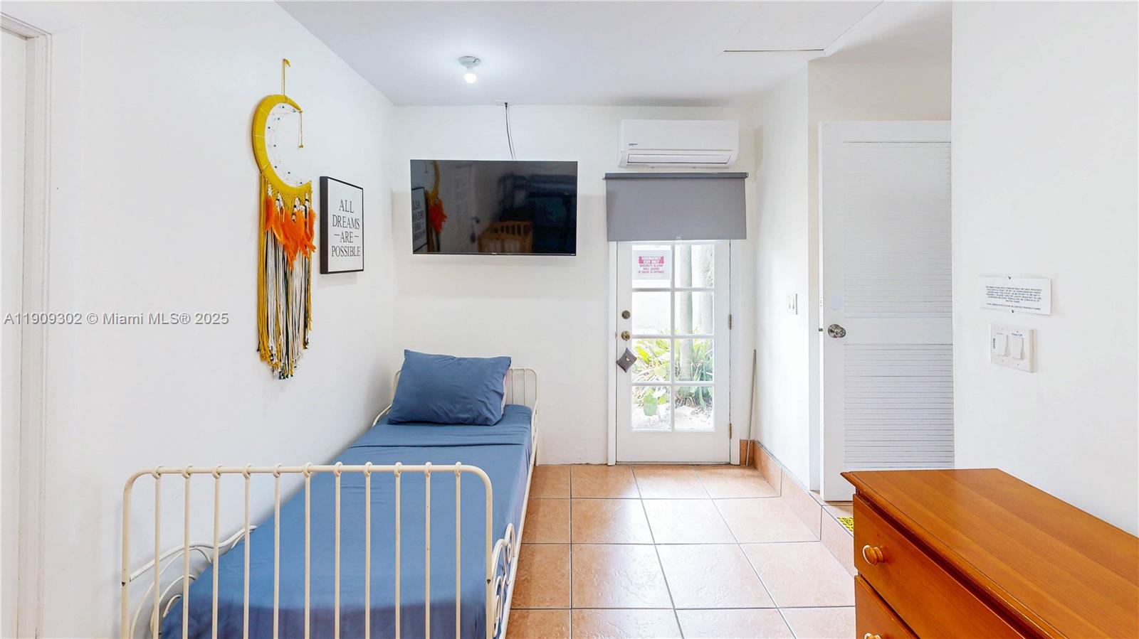 9614 Southwest 134th Court Miami, FL 33186 - Photo 25 of 69 a living room with furniture and a flat screen tv