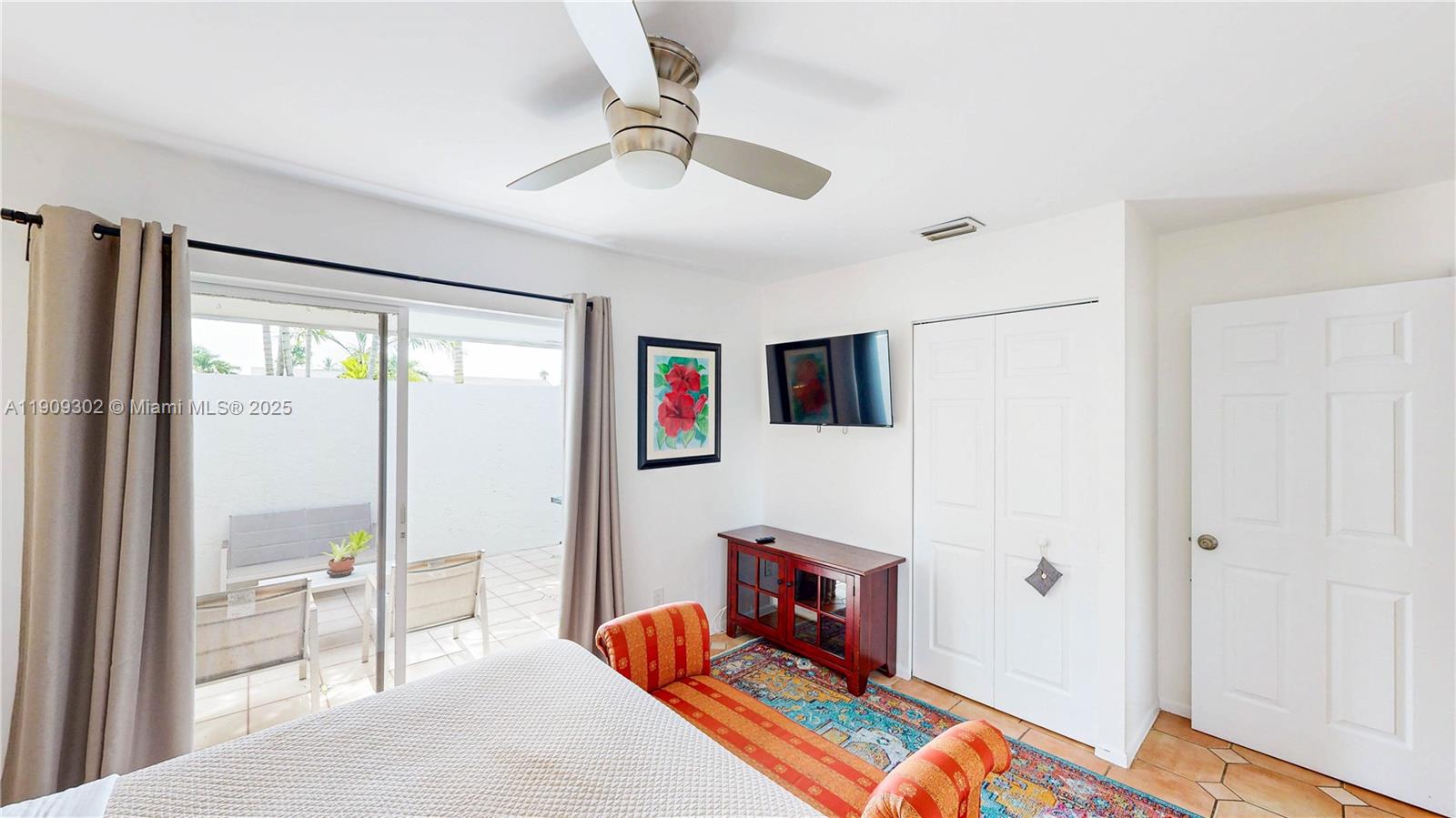 9614 Southwest 134th Court Miami, FL 33186 - Photo 35 of 69 a bedroom with furniture and a fireplace