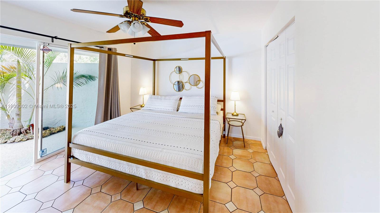 9614 Southwest 134th Court Miami, FL 33186 - Photo 36 of 69 a bedroom with a bed and a chandelier