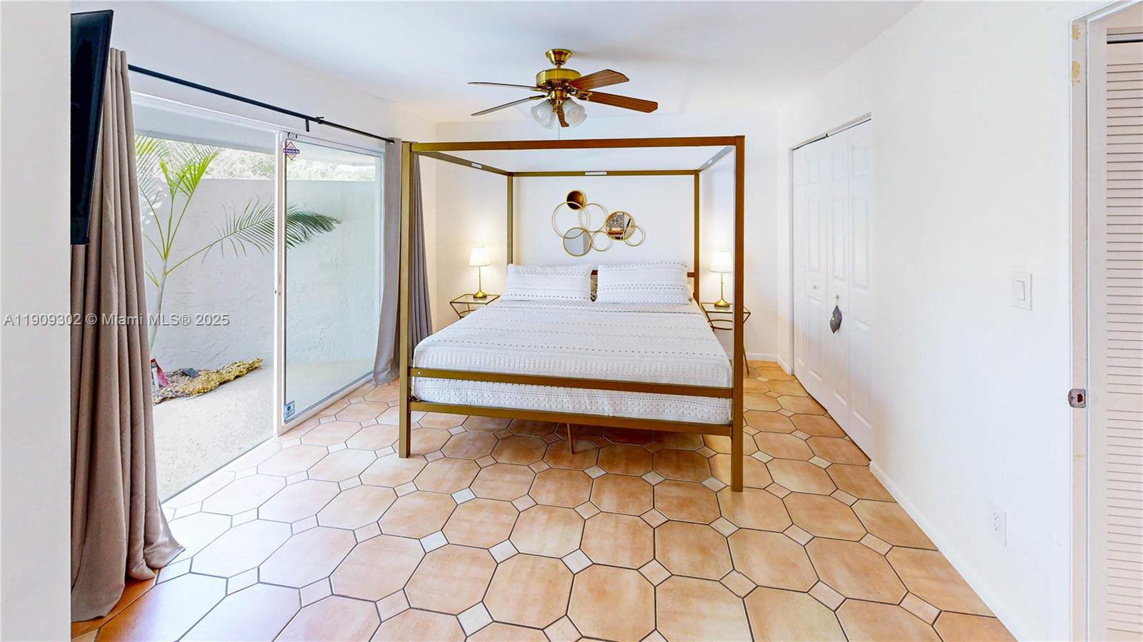 9614 Southwest 134th Court Miami, FL 33186 - Photo 37 of 69 a bed room with a bed and a mirror