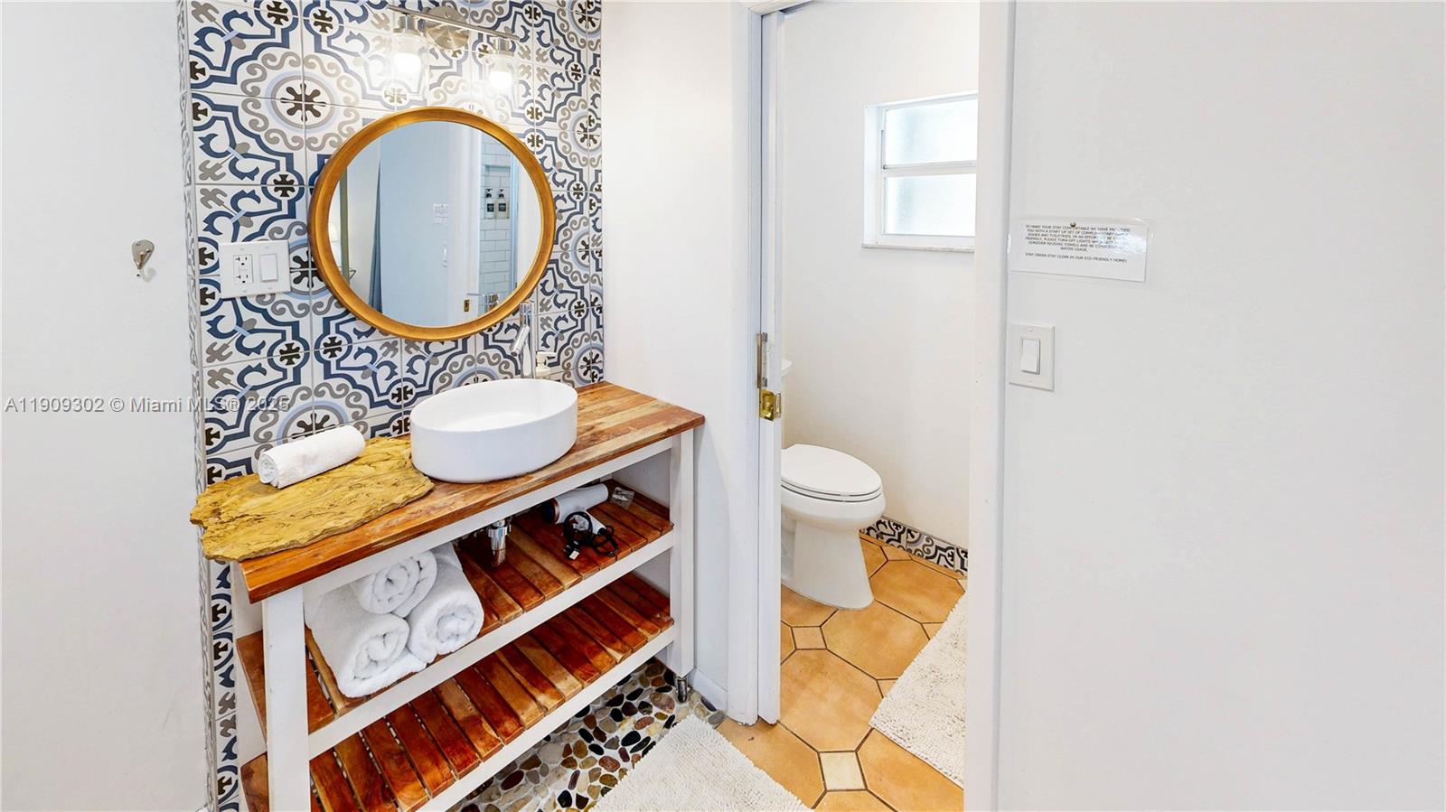 9614 Southwest 134th Court Miami, FL 33186 - Photo 39 of 69 a bathroom with a sink a mirror and a toilet