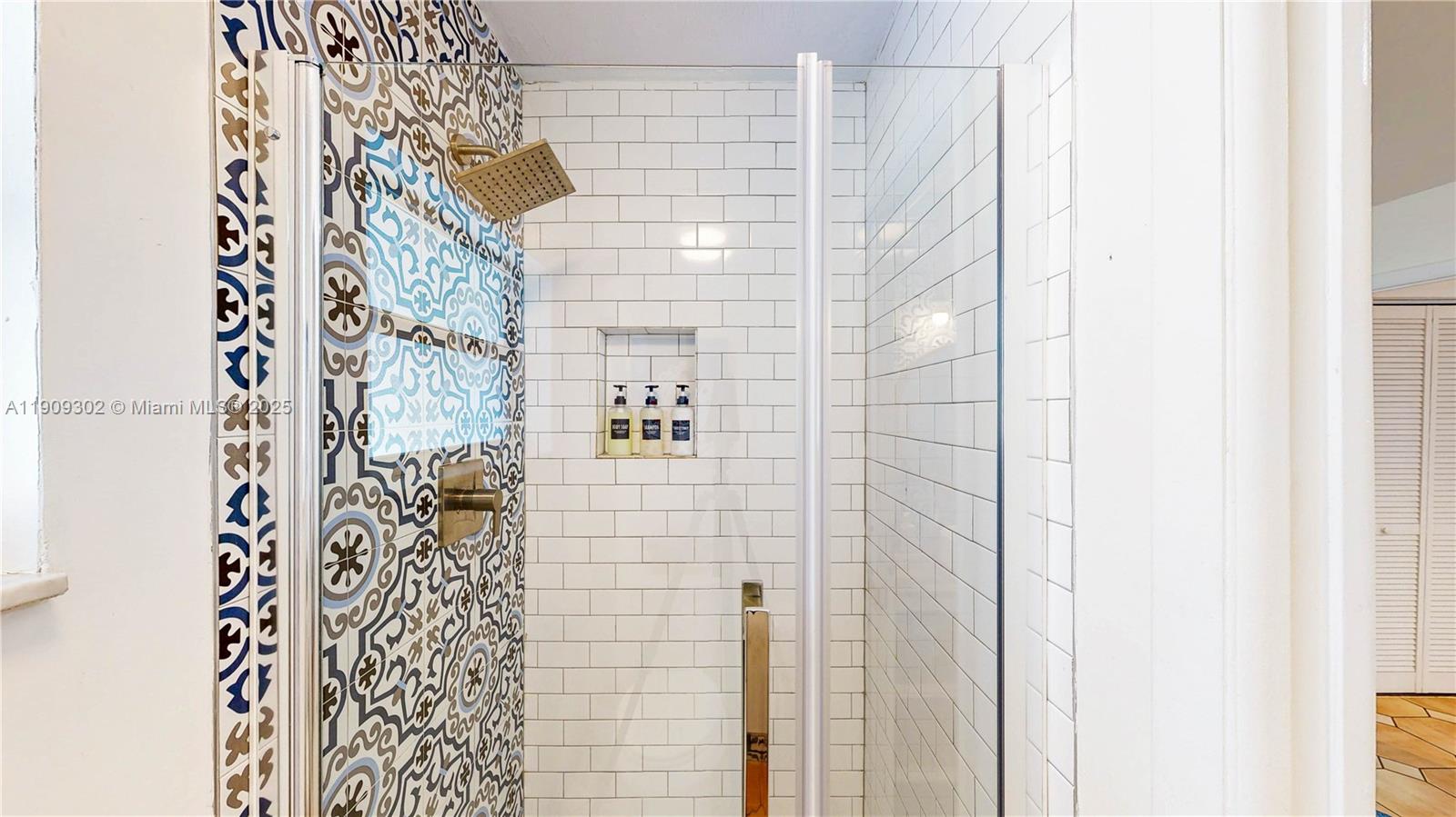 9614 Southwest 134th Court Miami, FL 33186 - Photo 40 of 69 a bathroom with a shower and a shower curtain