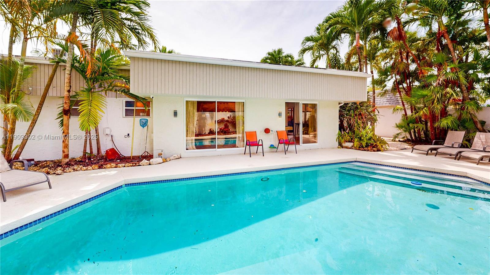 9614 Southwest 134th Court Miami, FL 33186 - Photo 50 of 69 a view of a swimming pool with an outdoor seating