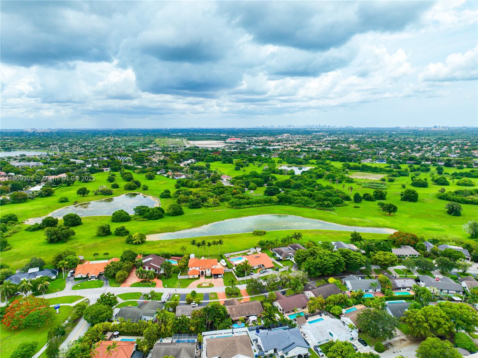 9614 Southwest 134th Court Miami, FL 33186 - Photo 67 of 69 a view of a bunch of flowers and trees in a garden