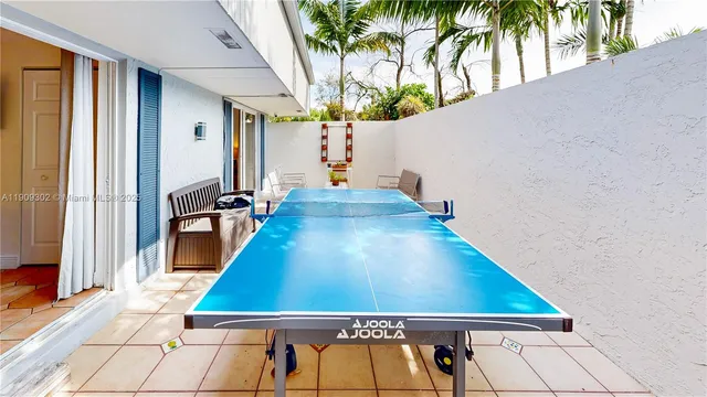 a dining hall with a dining table and chairs
