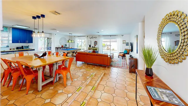 a living room with furniture fireplace and a window