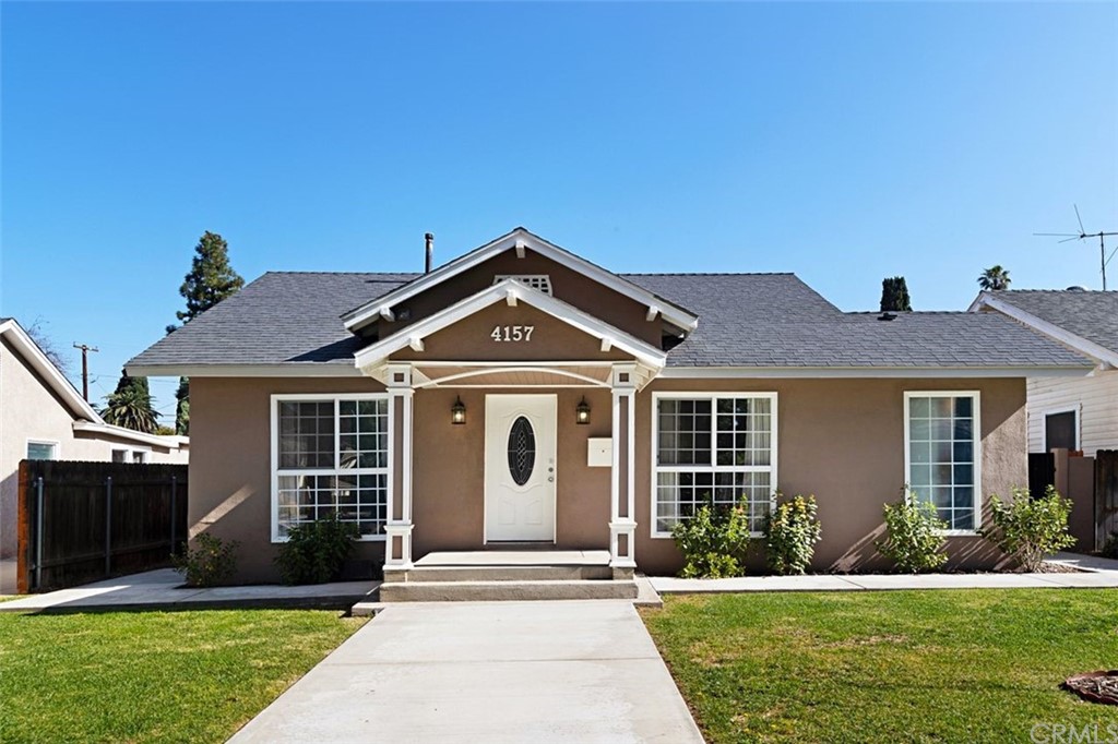 4157 Edgewood Place Riverside, CA 92506 - Photo 1 of 1 front view of a house with a yard