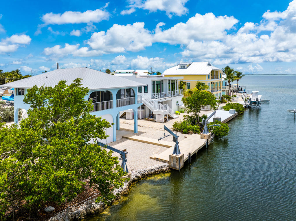 7 Calico Jack Circle Cudjoe, FL 33042 - Photo 8 of 17 a view of a house with swimming pool and sitting area