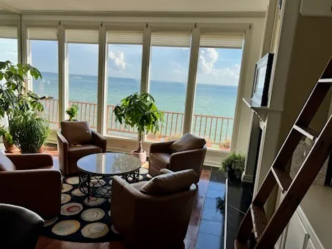 a living room with furniture and a large window