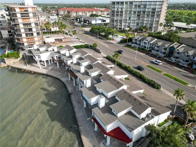 an aerial view of residential houses with outdoor space