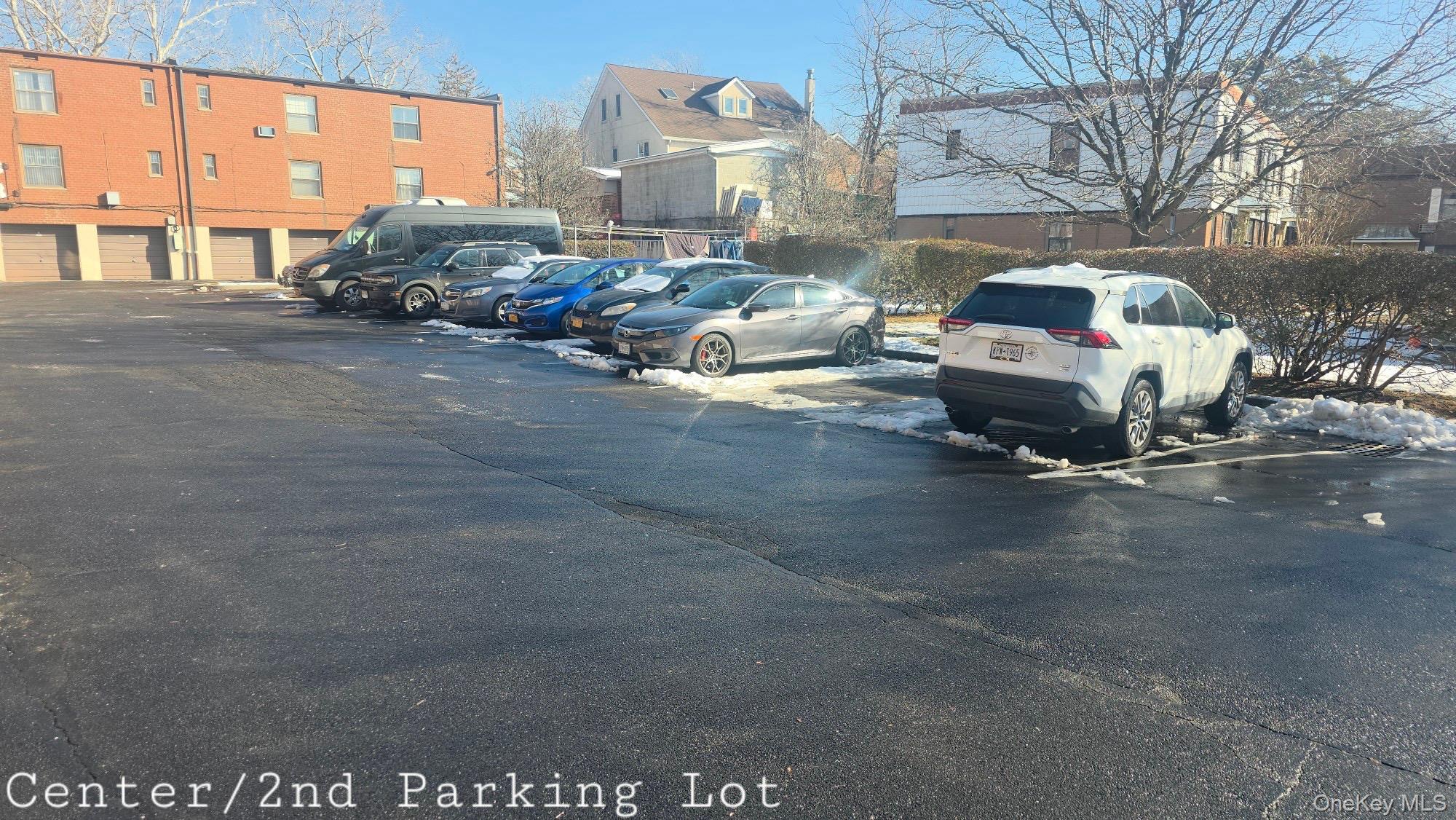 70-79 Park Drive East, Unit B Queens, NY 11367 - Photo 24 of 25 Uncovered parking lot featuring a residential view