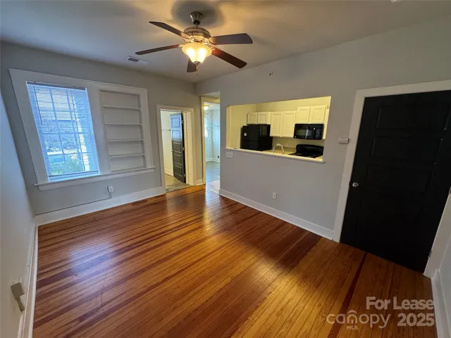 a view of livingroom with hardwood floor and ceiling fan