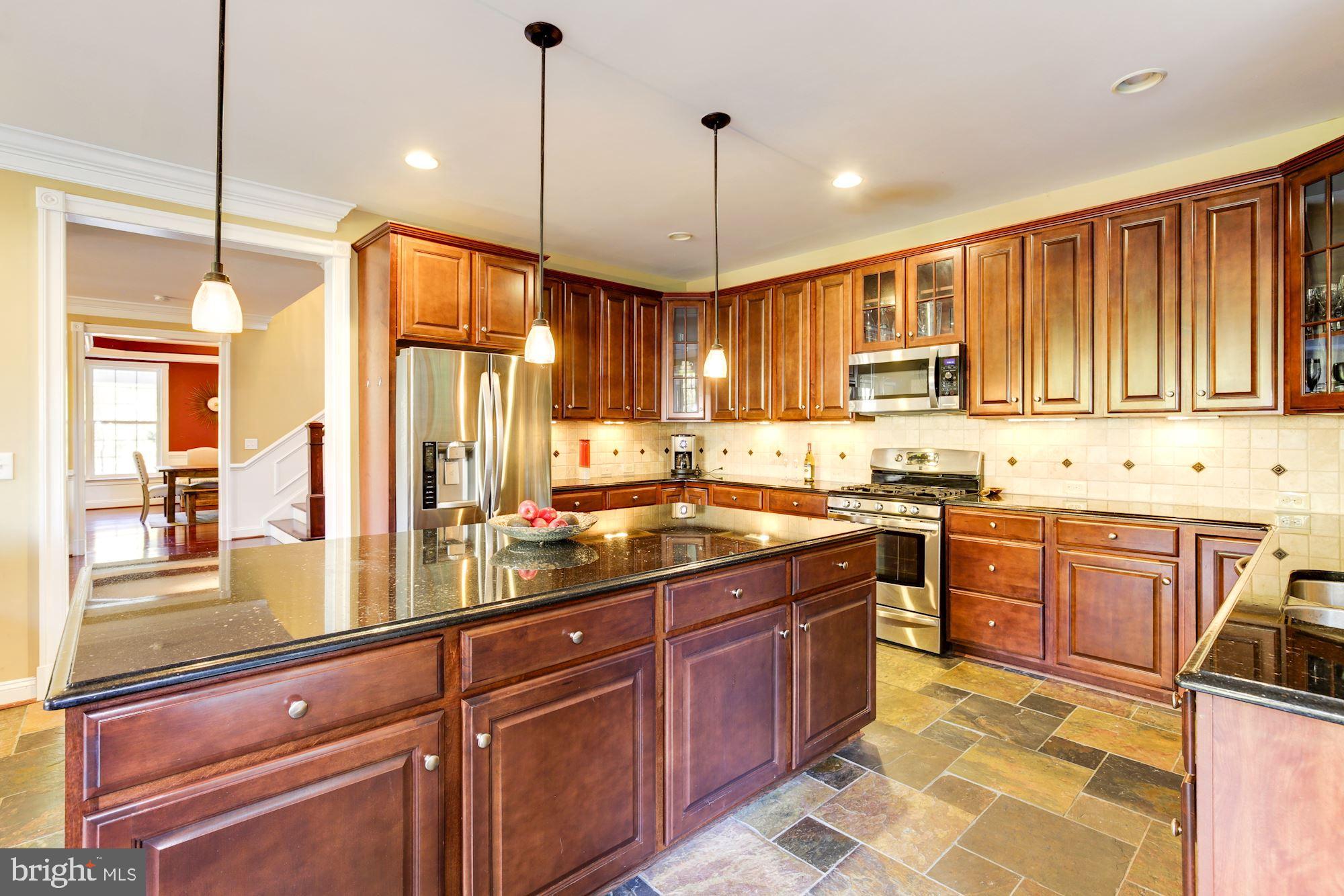 8100 Dogwood Road Baltimore, MD 21244 - Photo 12 of 53 Contemporary lighting and tile backsplash