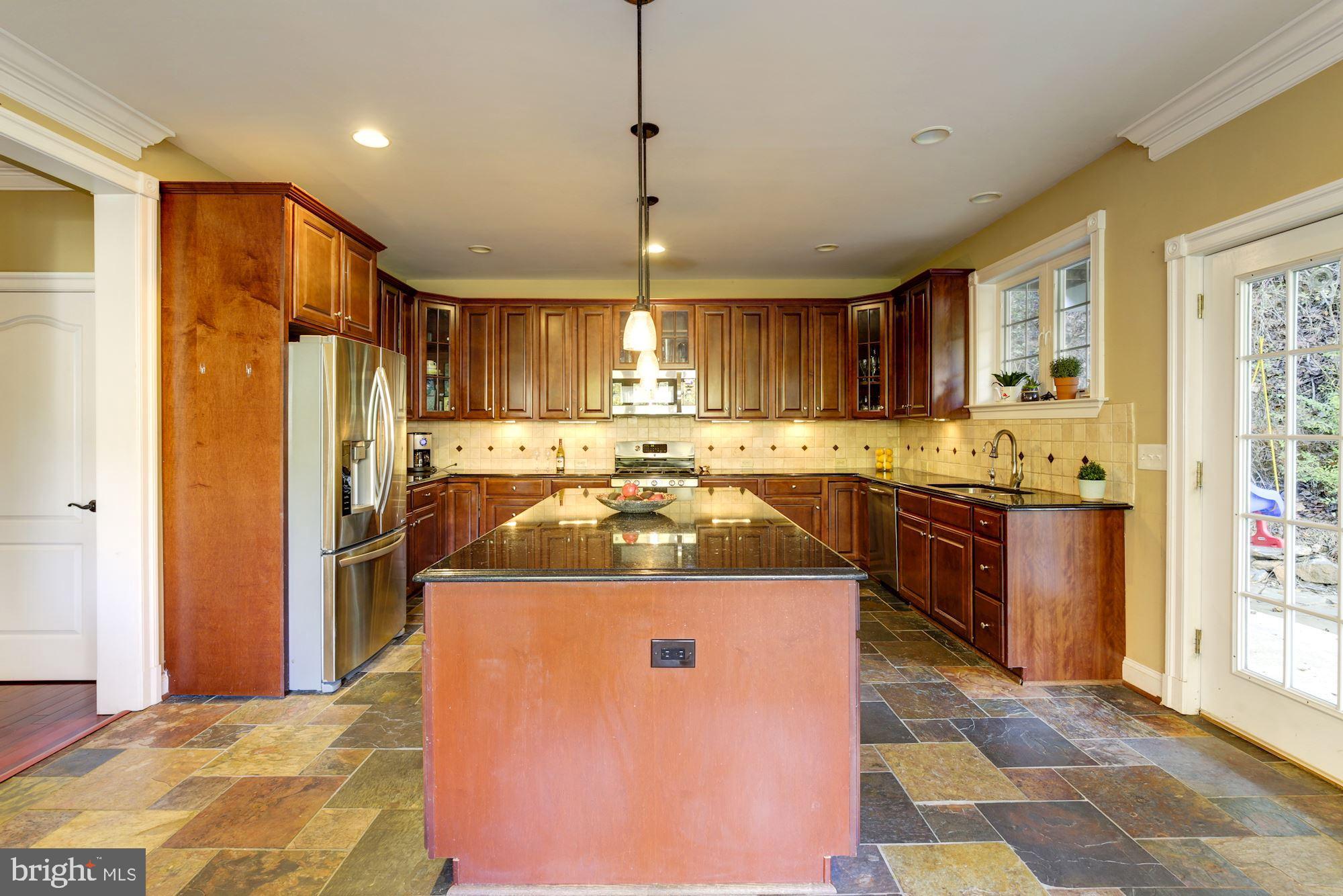 8100 Dogwood Road Baltimore, MD 21244 - Photo 13 of 53 Oversized island and slate flooring
