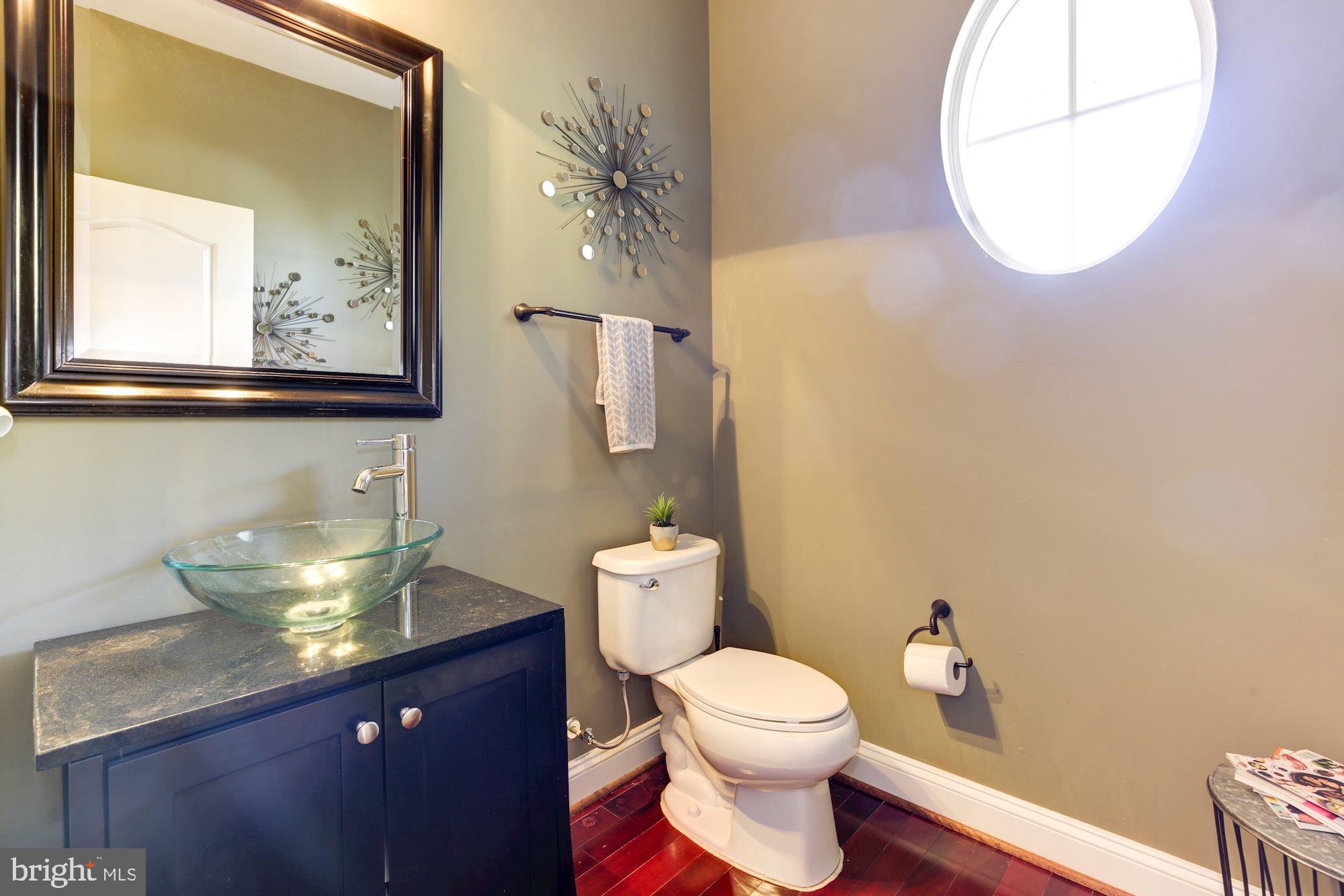 8100 Dogwood Road Baltimore, MD 21244 - Photo 24 of 53 Main level powder room with circle window