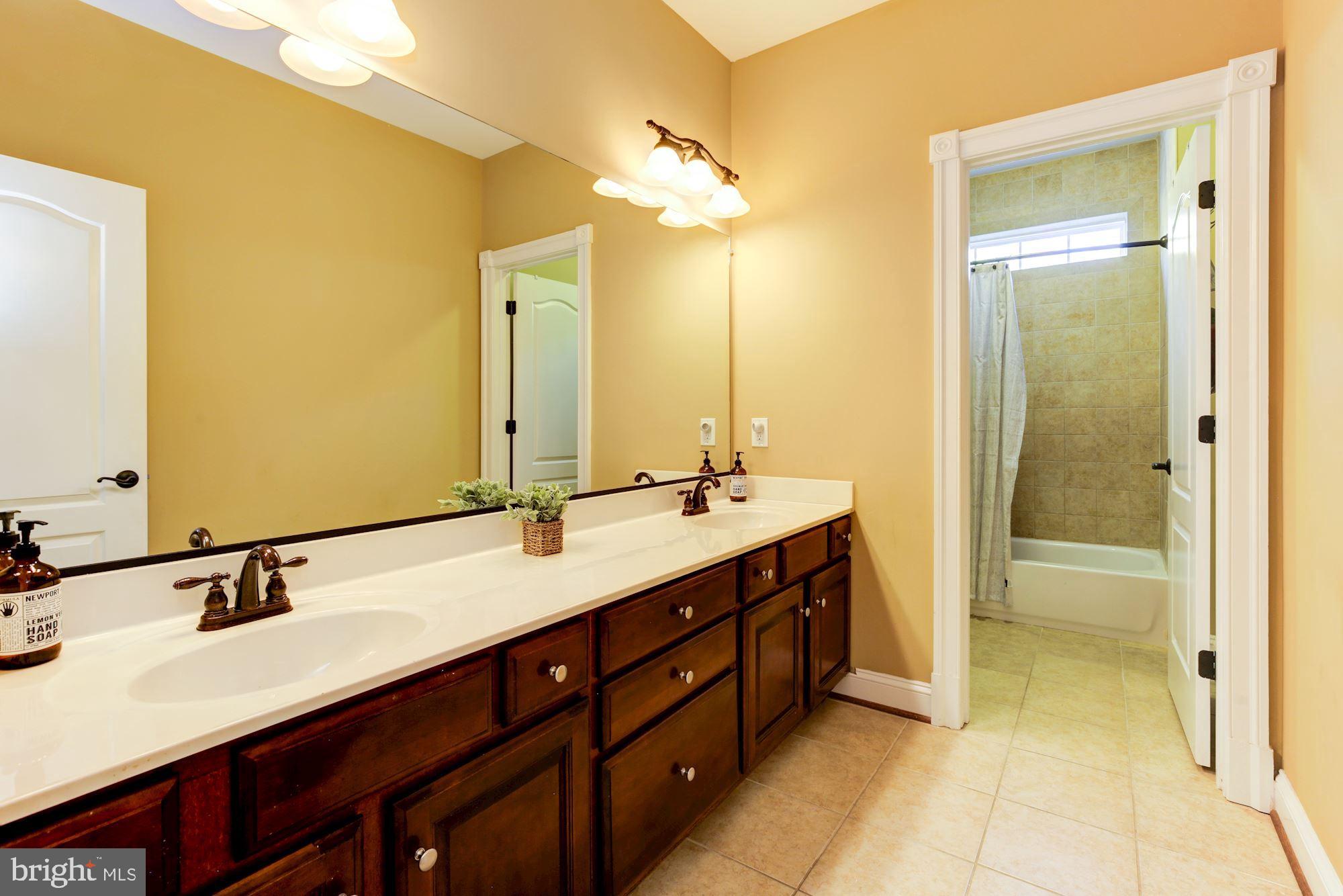 8100 Dogwood Road Baltimore, MD 21244 - Photo 37 of 53 Upper level hall bath offers double vanities