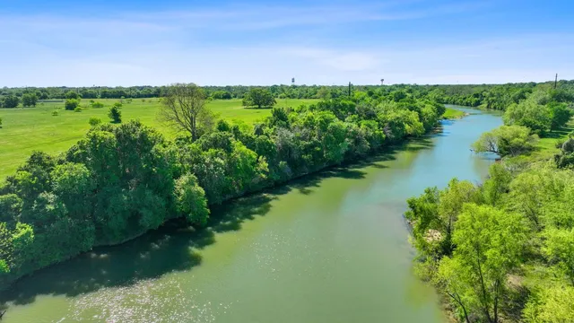 a view of lake with green space