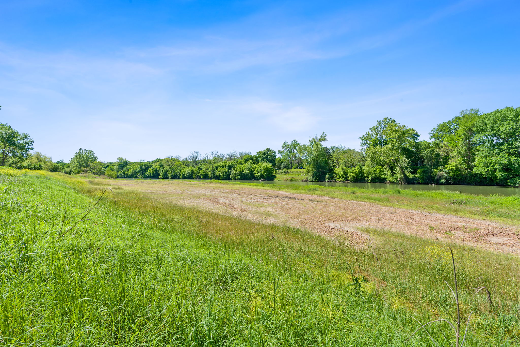 663 Sh 230 Loop Smithville, TX 78957 - Photo 21 of 36 a view of a lake with a big yard