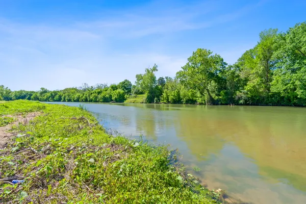 a view of a lake with a big yard