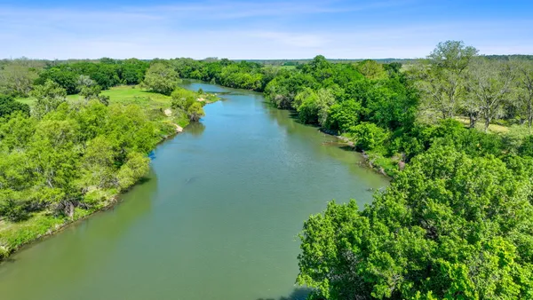 a view of a lake with a yard