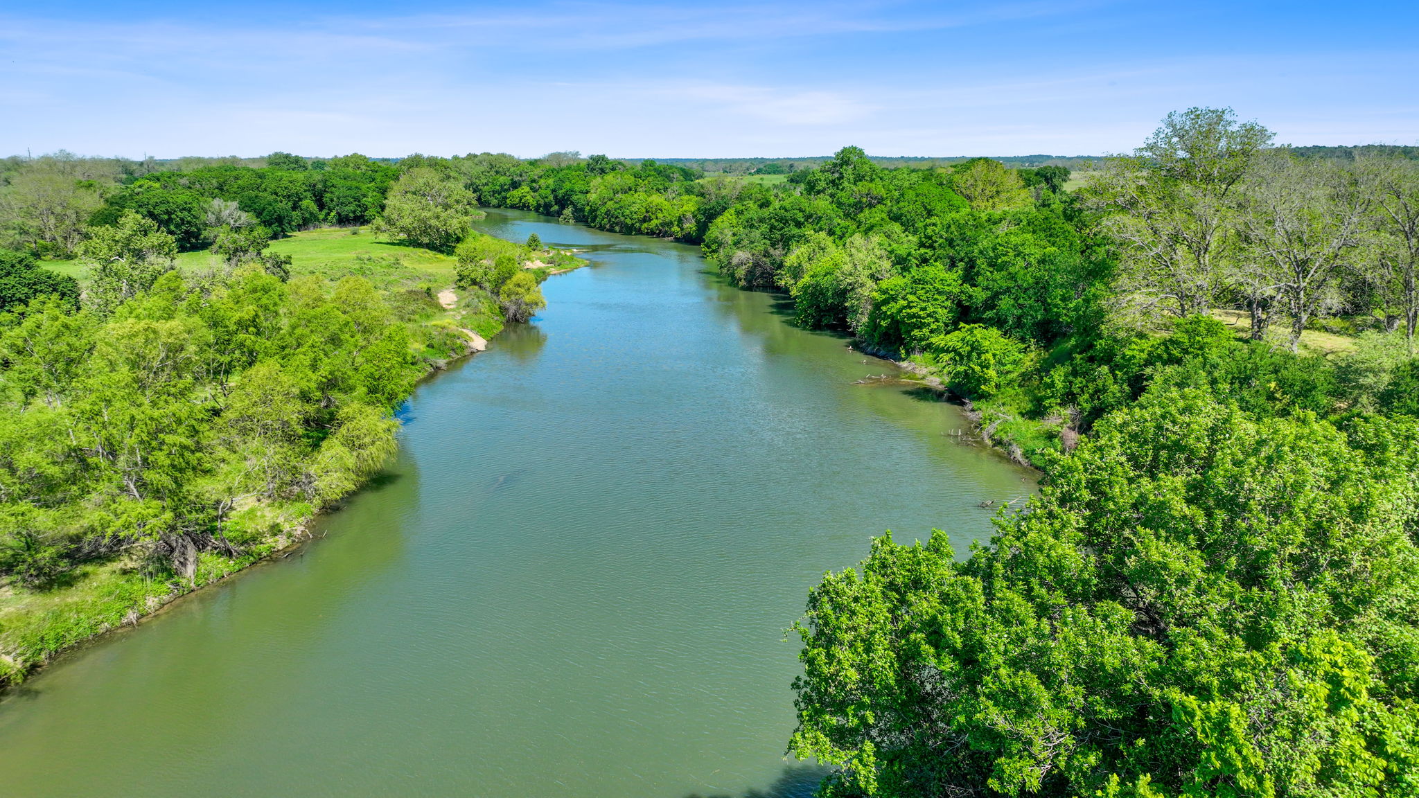 663 Sh 230 Loop Smithville, TX 78957 - Photo 3 of 36 a view of a lake with a yard