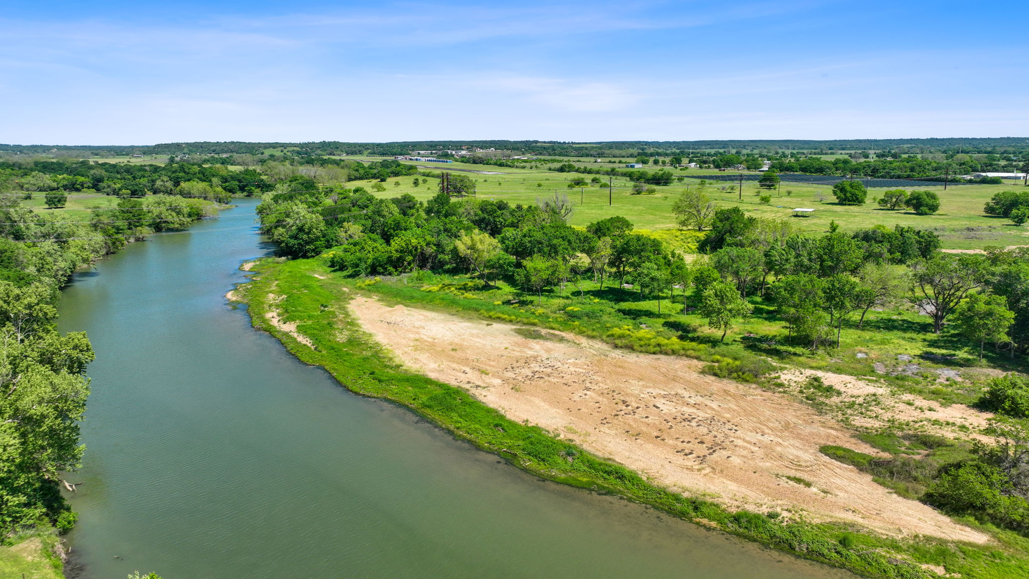 663 Sh 230 Loop Smithville, TX 78957 - Photo 7 of 36 a view of a lake with a city view