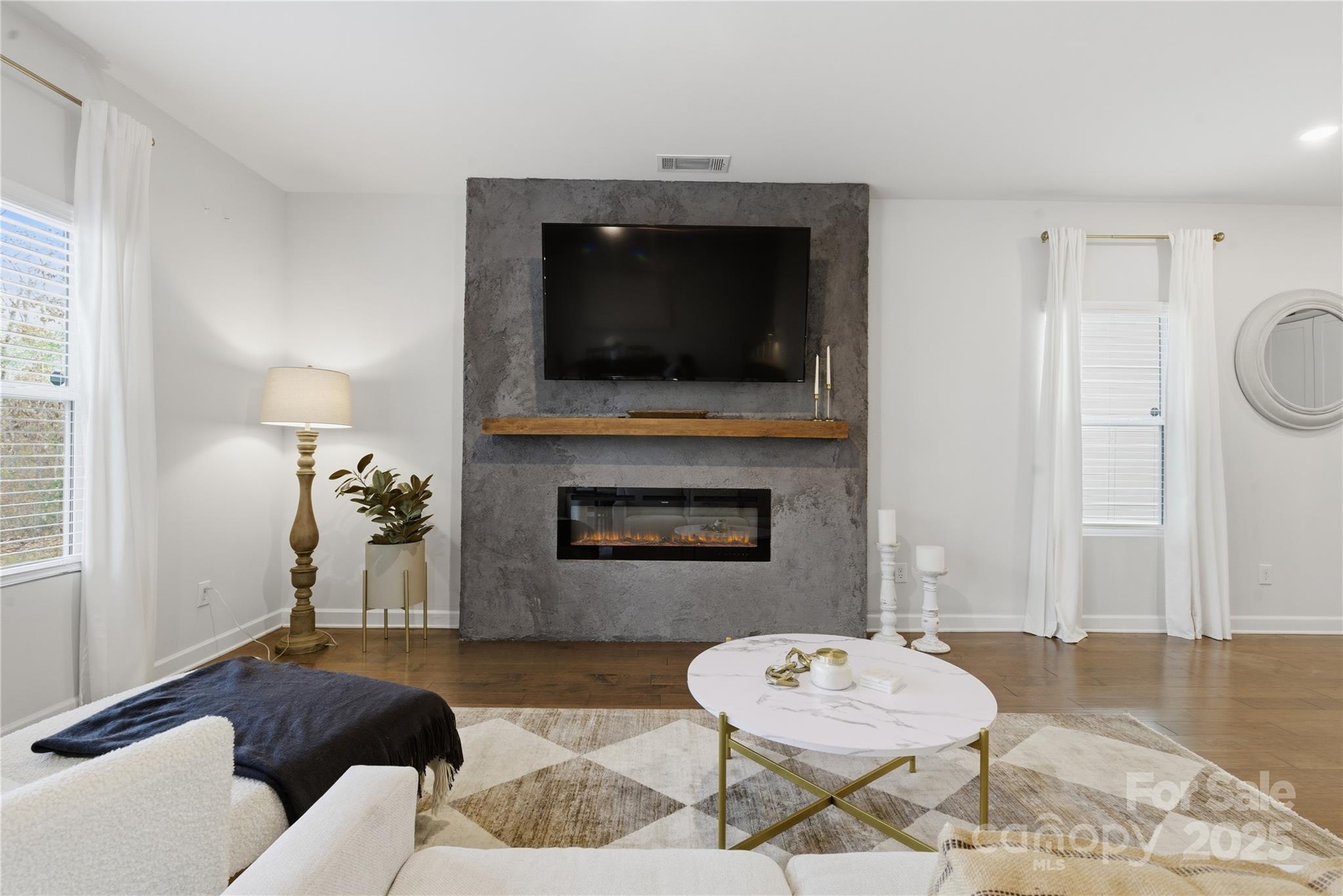 3528 Auburn Curb Road Charlotte, NC 28217 - Photo 11 of 35 a living room with furniture and a fireplace