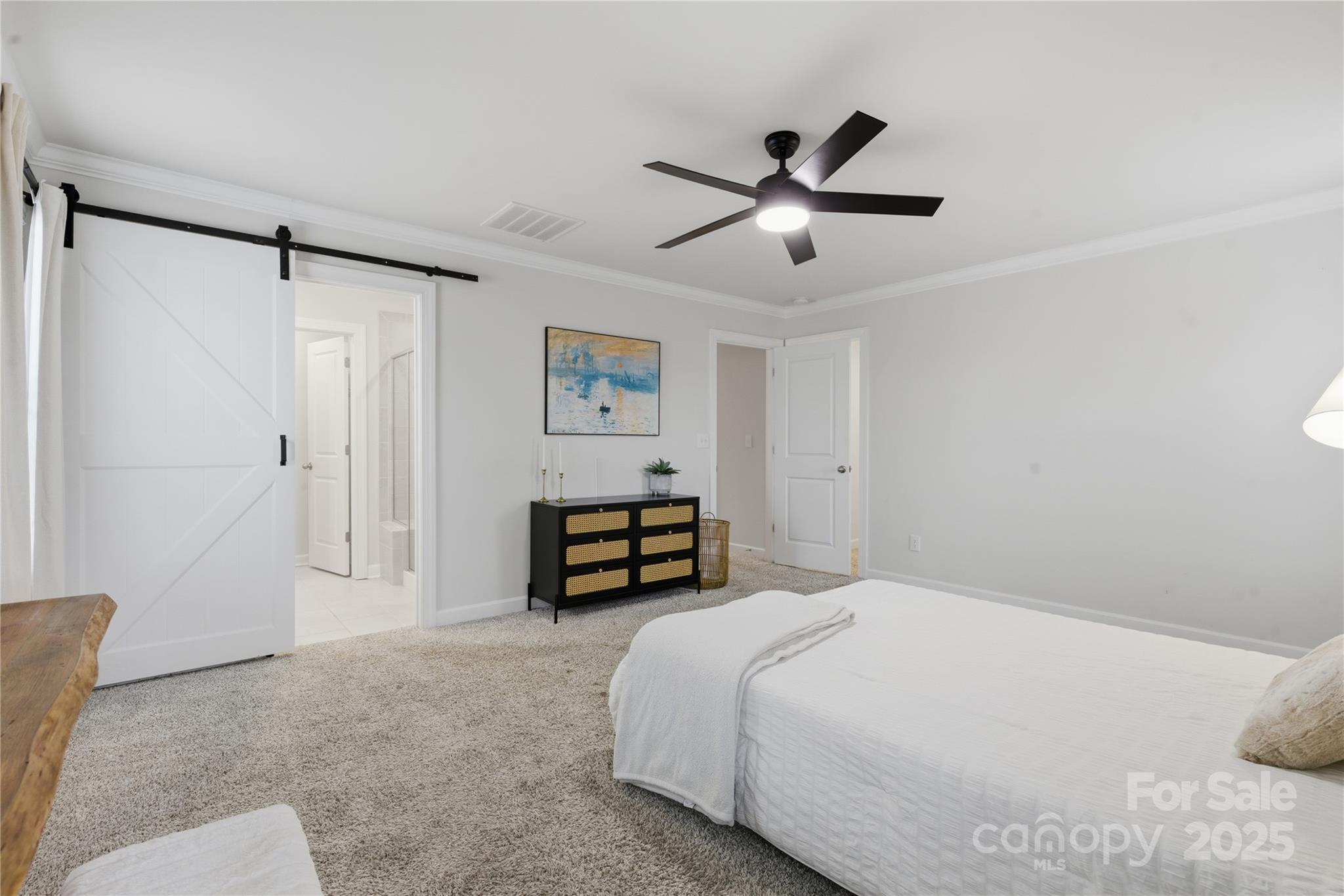 3528 Auburn Curb Road Charlotte, NC 28217 - Photo 20 of 35 a bedroom with a bed and cabinets