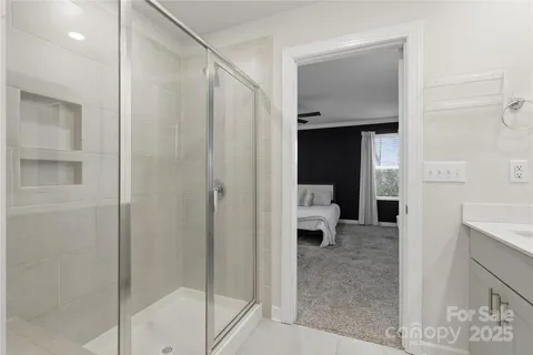 a bathroom with a shower and a sink