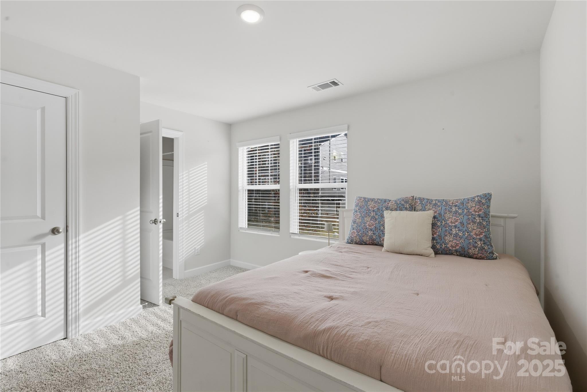 3528 Auburn Curb Road Charlotte, NC 28217 - Photo 23 of 35 a bedroom with a large bed and a window
