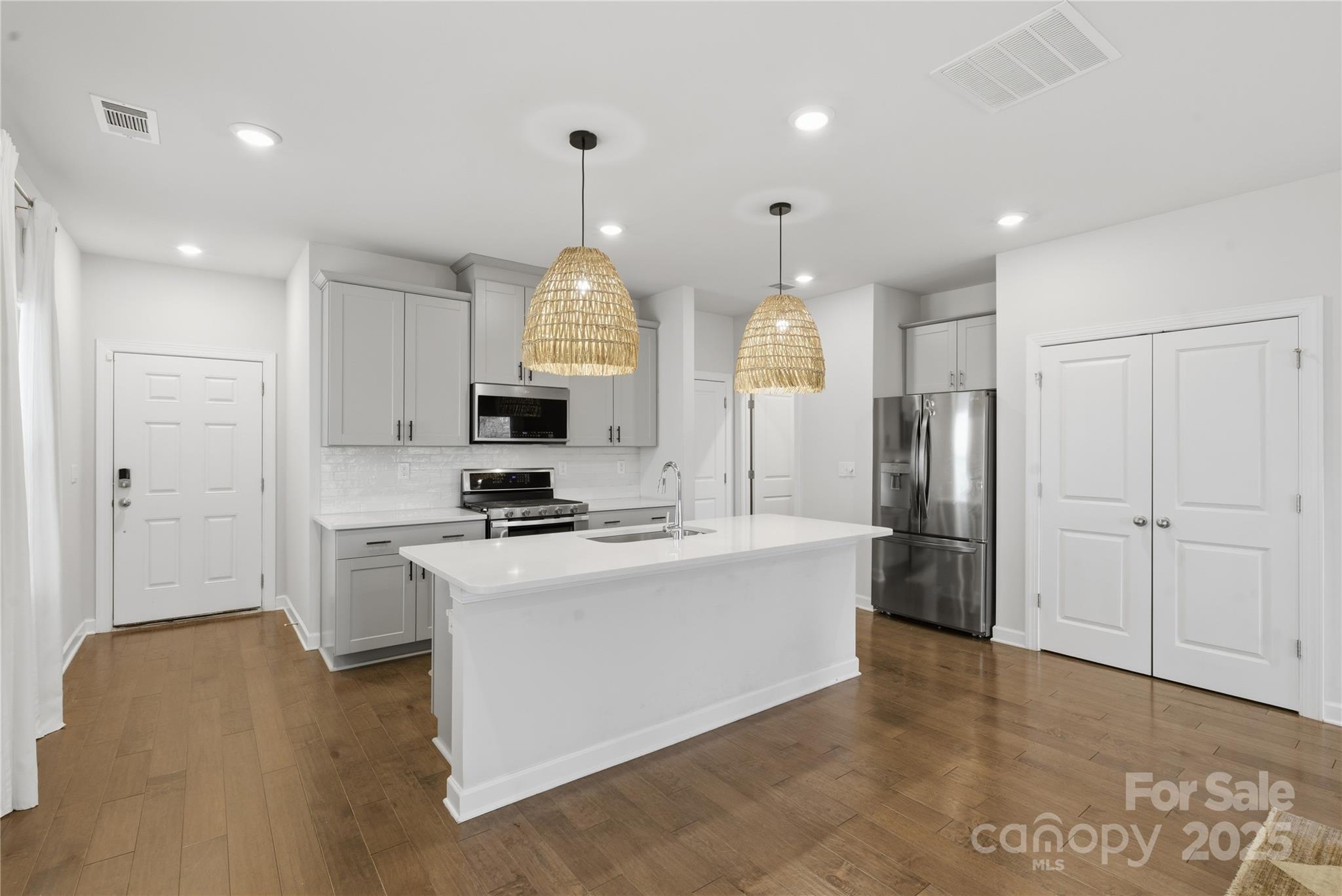 3528 Auburn Curb Road Charlotte, NC 28217 - Photo 4 of 35 a kitchen with stainless steel appliances a refrigerator a stove a sink and a refrigerator