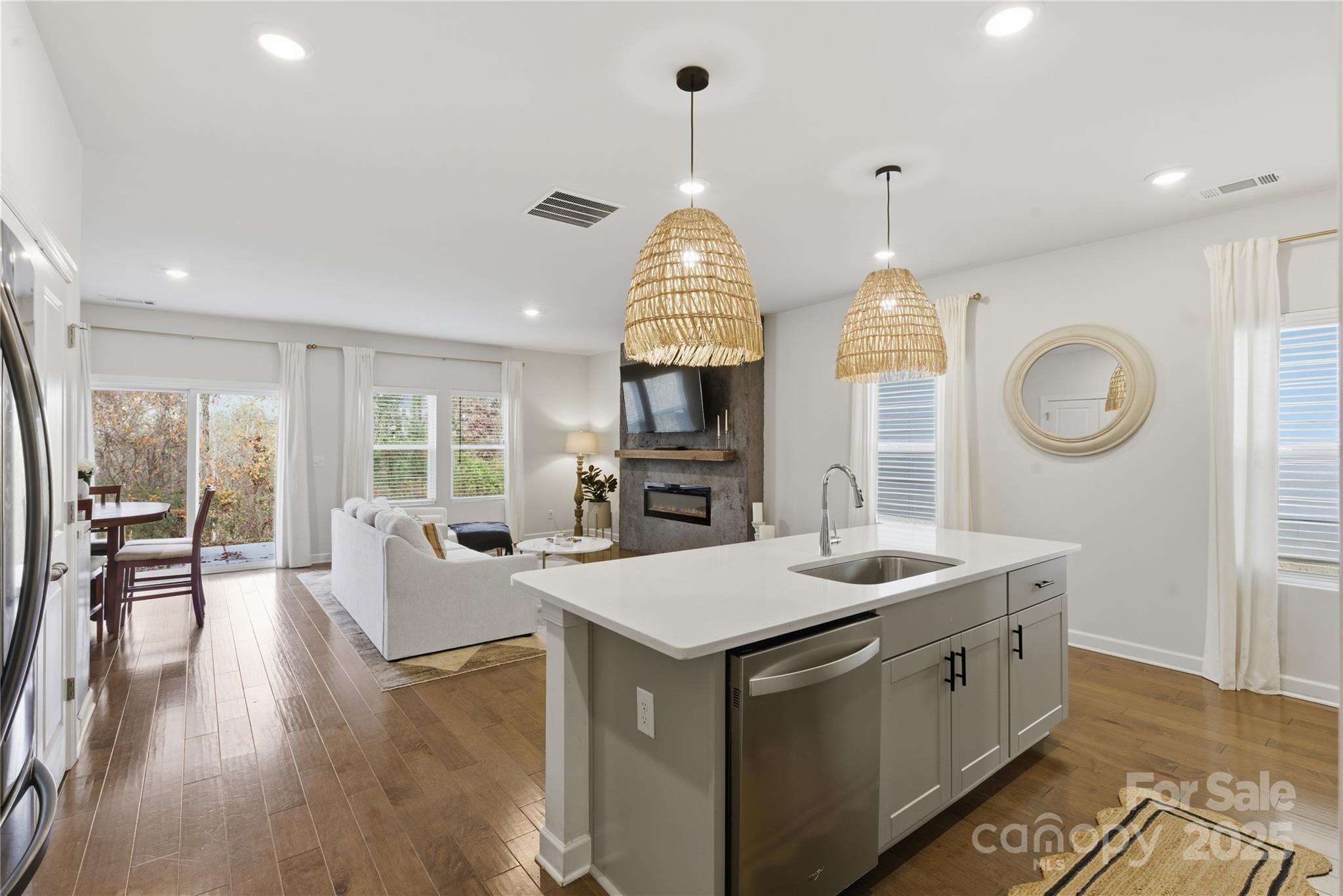 3528 Auburn Curb Road Charlotte, NC 28217 - Photo 7 of 35 a kitchen with a sink stove and wooden floor