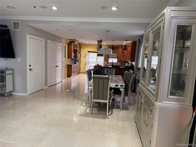 a view of a living room with furniture and a flat screen tv